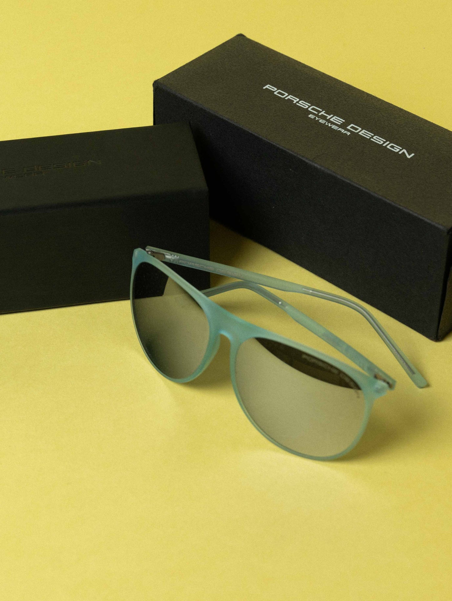 PORSCHE DESIGN Grey Oval Unisex Sunglasses - Transparent Blue